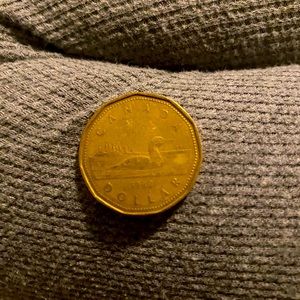 Rare 1989 Elizabeth II Canadian Dollar. This coin is denominated as a dollar.
